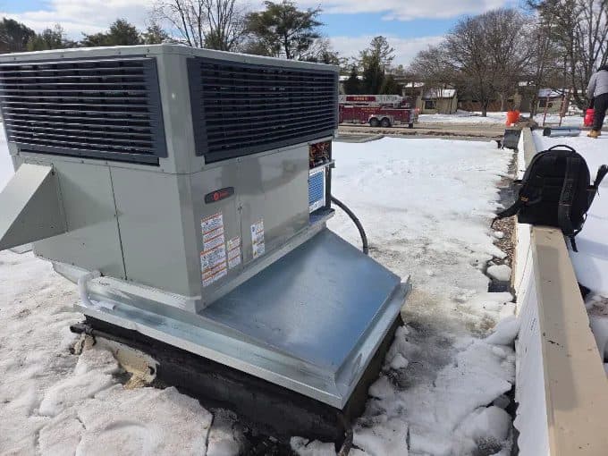 Trane commercial rooftop HVAC unit on a new curb adapter installed by KelAire HVAC