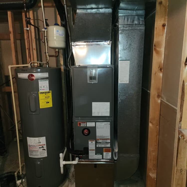 Water heater and air handler installed together in a utility room